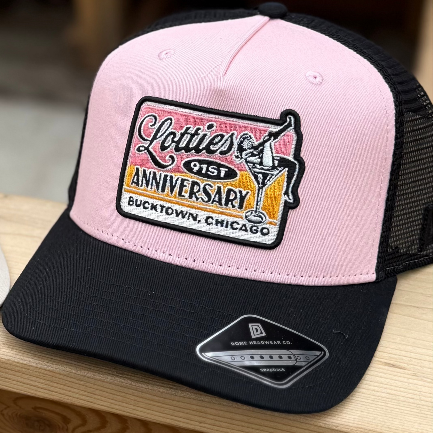 Lotties 91st Anniversary, Bucktown, Chicago, Pink and Black Trucker Hat with a Limited Edition Lotties 91st Anniversary patch.