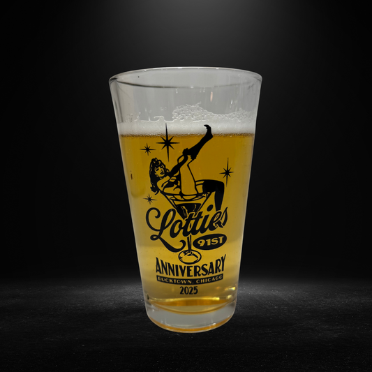 Pint glass with 'Lottie's Anniversary' design on a dark background